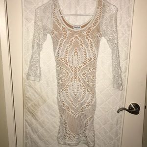 White and nude Bebe bodycon dress